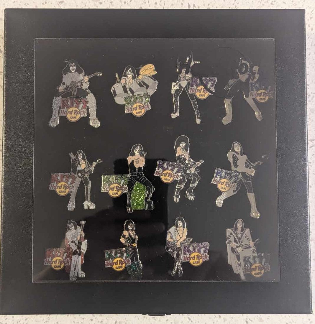 Lot of 12 KISS HARD ROCK CAFE Pins with Display Case